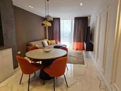 a living room with a table and chairs and a couch at Diamond Beach Sarafovo by KP - Luxury Collection, Apt 6 in Burgas City