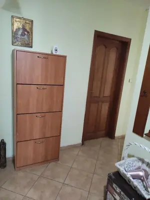 a room with a wooden cabinet and a door at Стая за гости на гр.Бургас in Burgas City