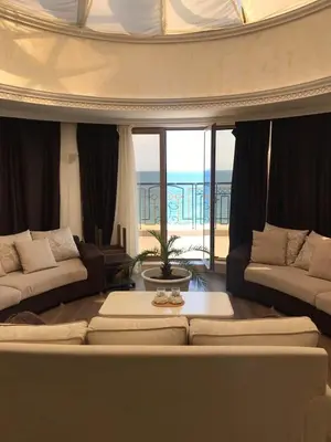 a living room with a couch and a table at Penthouse Happy Moments in Sunny Beach