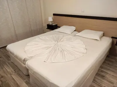 a large white bed in a room at Urlaub - Obzor Beach Resort A109 in Obzor