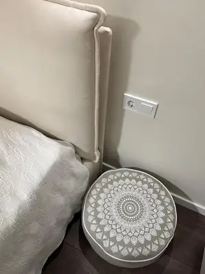 a white bowl sitting on the floor next to a bed at New luxury furnished apartment - beach, Varna center & fast Wi-FI in Varna City