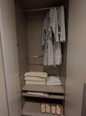 a closet with a bunch of towels and clothes at New luxury furnished apartment - beach, Varna center & fast Wi-FI in Varna City