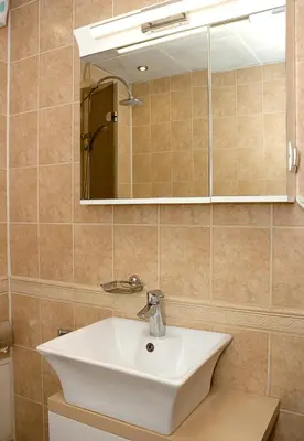 a bathroom with a sink and a mirror at Cozy 1BD Apartment with Free Parking in the Area by Flat Mаnager in Varna City
