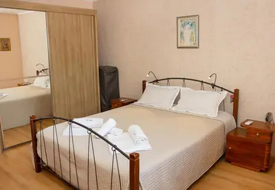 a hotel room with a bed with a mirror at Cozy 1BD Apartment with Free Parking in the Area by Flat Mаnager in Varna City