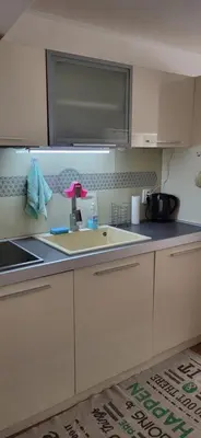 a kitchen with a sink and a counter top at Cozy apartment in the hart of the city in Varna City