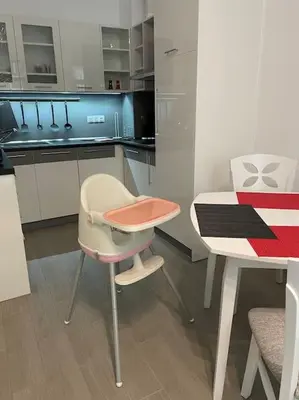 a kitchen with a table and a table and chairs at Sonne, Meer und mehr in Nesebar