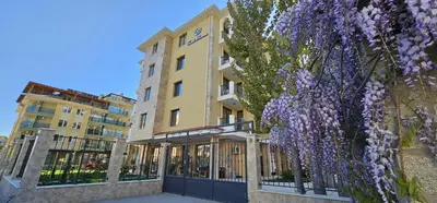 a building with a wreath of purple flowers at Emilia Romana Park in Sunny Beach