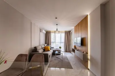 a living room with a couch and a tv at Emilia Romana Park in Sunny Beach