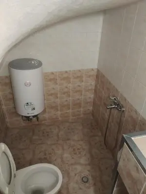 a bathroom with a toilet and a shower at Апартамент стоенчо хаджииванов,10 in Varna City