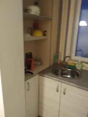 a small kitchen with a sink and a window at Апартамент стоенчо хаджииванов,10 in Varna City