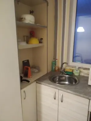 a kitchen with a sink and a window at Апартамент стоенчо хаджииванов,10 in Varna City