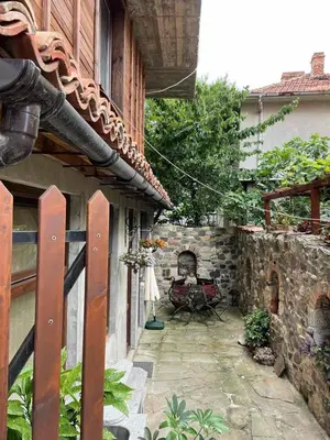 a patio outside of a house with a fireplace at Sozopol Old Town - Studio 1 in Sozopol