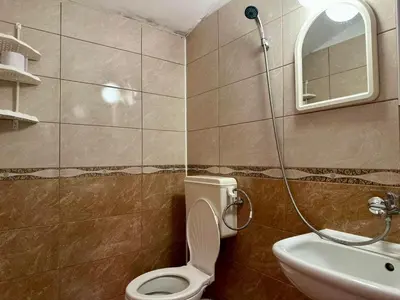 a bathroom with a toilet and a sink at Sozopol Old Town - Studio 5 Attic in Sozopol