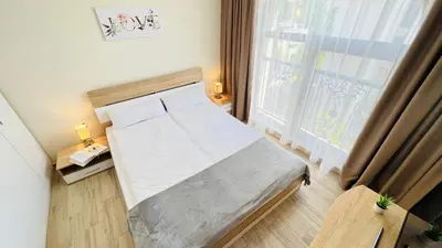 a bedroom with a bed and a large window at Attractive Family Apartment in Sunny Beach Cascadas Family Resort in Sunny Beach