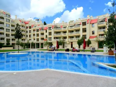 a large swimming pool in front of a large building at Апартаменти Варна Саут на плажа 2 - Varna South Apartments on the beach 2 in Varna City