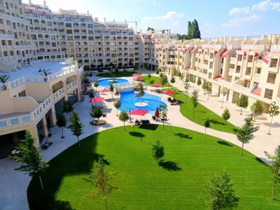 an apartment complex with a large courtyard with a swimming pool at Апартаменти Варна Саут на плажа 2 - Varna South Apartments on the beach 2 in Varna City