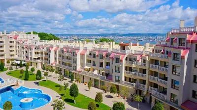 an apartment building with a courtyard and a pool at Апартаменти Варна Саут на плажа 2 - Varna South Apartments on the beach 2 in Varna City