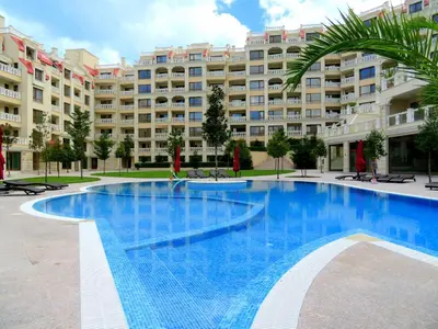 a large swimming pool in front of a large building at Апартаменти Варна Саут на плажа 2 - Varna South Apartments on the beach 2 in Varna City