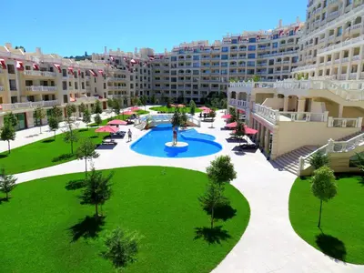 an apartment complex with a large courtyard with a fountain at Апартаменти Варна Саут на плажа 2 - Varna South Apartments on the beach 2 in Varna City