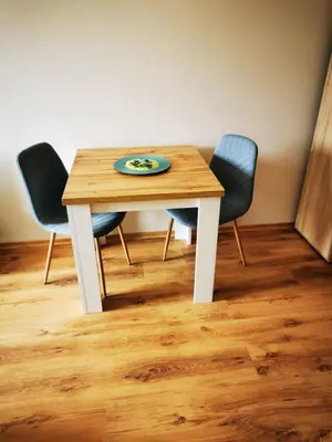 a wooden table with three chairs and a plate on it at Студио Sun day в Royal palm, Свети Влас in Sveti Vlas