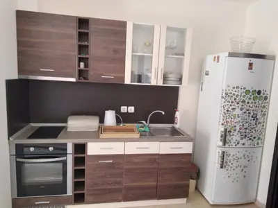 a small kitchen with a refrigerator and a sink at Курортен коплекс Елените,община Несебър,област Бургас in Emona