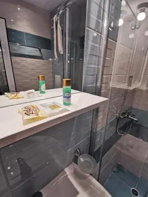 a bathroom with a shower and a sink at Admiral Plaza Sunrise Apartments C13 in Sunny Beach