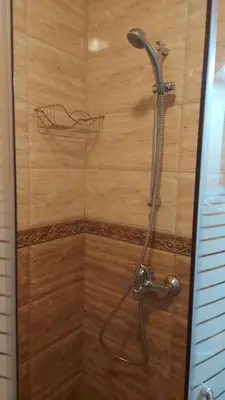 a shower with a shower head in a bathroom at Aphrodite Park in Sunny Beach