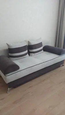 a bed with two pillows on it in a room at Aphrodite Park in Sunny Beach