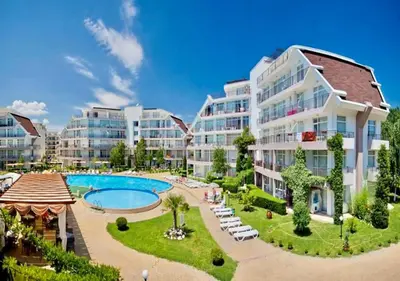 an apartment complex with a pool and a resort at Charming 2-bed flat with pool view in Sunny Beach, Bulgaria in Sunny Beach