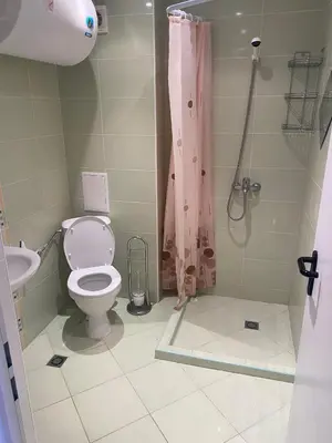 a bathroom with a toilet and a shower at Midia Family Resort, Aheloy in Aheloy