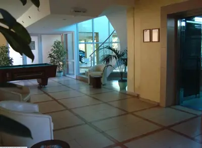 a lobby with a pool table in a building at VECHNA R 18 Studio Sunny Beach in Sunny Beach