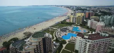 an aerial view of a beach and the ocean at VECHNA R 18 Studio Sunny Beach in Sunny Beach