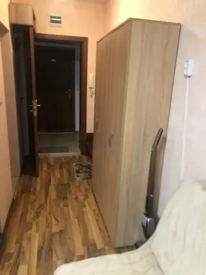 a room with a closet and a wooden floor at Studio Sveti Vlas 