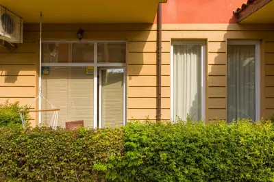 a house with a window and a bush at Todorka Sunny View Central w Słonecznym Brzegu in Sunny Beach