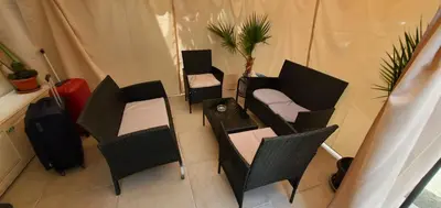 an overhead view of a room with chairs and a table at DELUXE TOP CENTER House with garden's tent ,2 bedrooms and living room next to the BEACH and SEA GARDEN- 5 min by walk,with equiped kitchen in Burgas City
