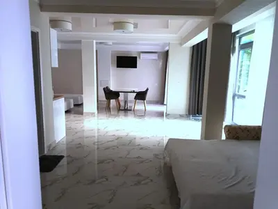 a living room with a table and chairs at Apartment Ground Floor in Pomorie