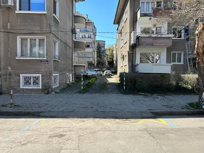 an empty street in a city with buildings at Niya Apartment Bourgas in Burgas City