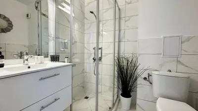 a bathroom with a shower and a toilet and a sink at ALEX BEACH Apartello·com - Amazing apartments with sea view! in Sveti Vlas