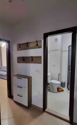 a bathroom with a toilet and a mirror at Deluxe Appartement in Cascadas Resort Sunny Beach in Sunny Beach