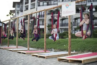 a group of children jumping on a playground at APARTELLO⊛com DIAMOND - private apartments near Marina Dinevi in Sveti Vlas in Sveti Vlas