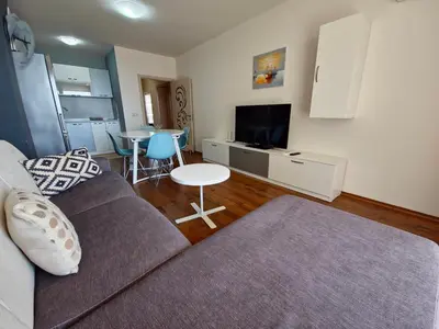 a living room with a couch and a table at Diamond Beach Sarafovo by KP in Burgas City
