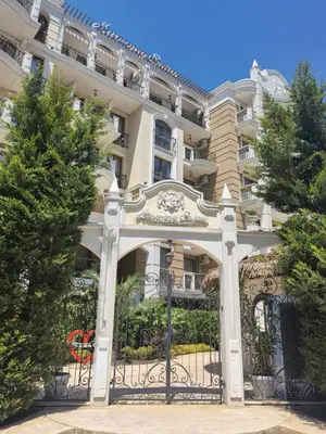 a building with a gate in front of it at Harmony Suitеs apartment in Sunny Beach