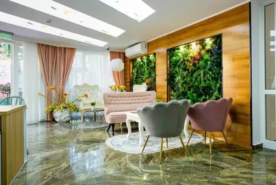 a living room with a table and chairs at Sunny studio in Sweet Home Complex in Sunny Beach