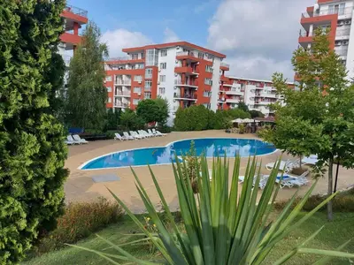 a swimming pool in front of a apartment complex at Apartment in Sveti Vlas in Sveti Vlas