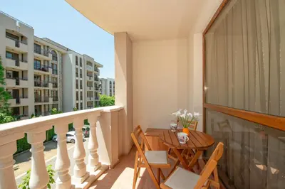 a balcony with a table and chairs on a balcony at Cascadas Holiday Apartments in Sunny Beach