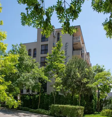 a building with trees in front of it at Cascadas Holiday Apartments in Sunny Beach