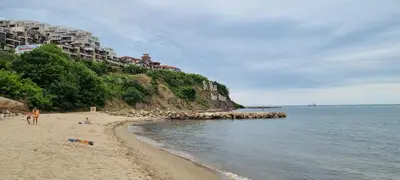 a beach with people on the sand and the water at Two room apartment in Etara 3, Sveti Vlas in Sveti Vlas