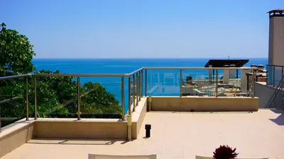 a balcony with a view of the ocean at Byala Cliff Sea View Penthouse in Byala