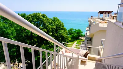 a balcony of a building with a view of the ocean at Byala Cliff Sea View Penthouse in Byala