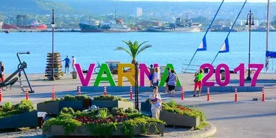 a group of people standing in front of a sign that reads war at Апартамент Далия - Apartment Dalia in Varna City